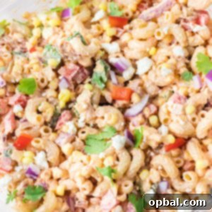 Elote Pasta Salad 13 Close-up photo of Mexican Street Corn Pasta Salad is light and healthy, yet so delicious. It’s the perfect side or main dish for a big gathering or just a quick meal during the week with a Mexican twist!