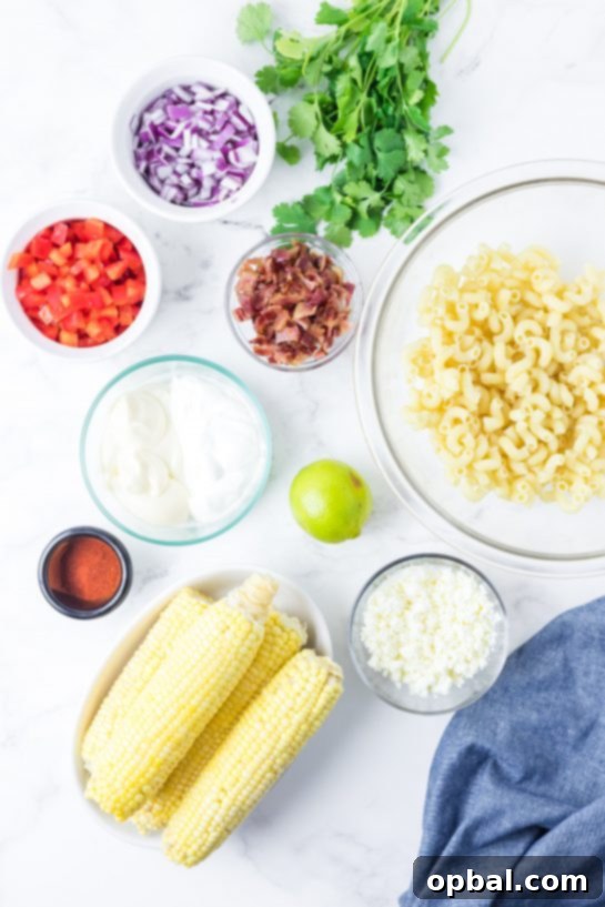 Elote Pasta Salad 3 Ingredients needed for the Mexican Street Corn Pasta Salad recipe, showcasing fresh vegetables, pasta, and spices.