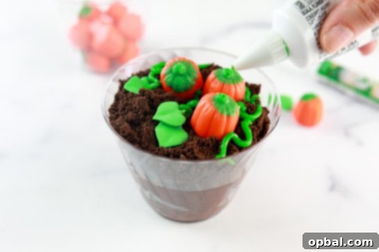 Edible Pumpkin Patch 4 Close-up view of the finished pumpkin patch dirt cups, showcasing their charming details