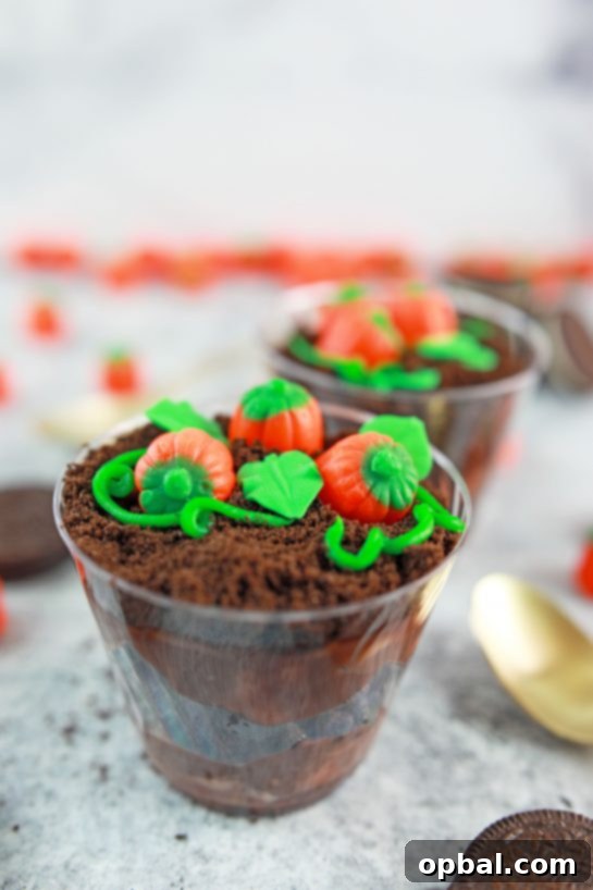 Edible Pumpkin Patch 8 Cute individual Pumpkin Patch Dirt Cups, an adorable and simple dessert for fall, Thanksgiving, and Halloween parties