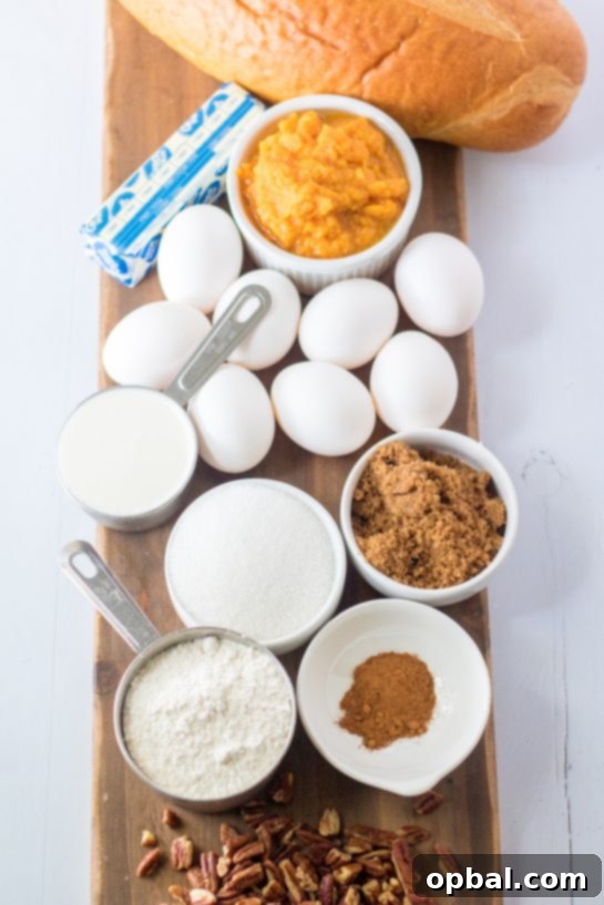Spiced Sweet Potato French Toast Bake 4 A vibrant display of fresh ingredients for Sweet Potato French Toast Casserole, including bread, heavy cream, sugars, canned sweet potatoes, eggs, vanilla, and pumpkin pie spice.