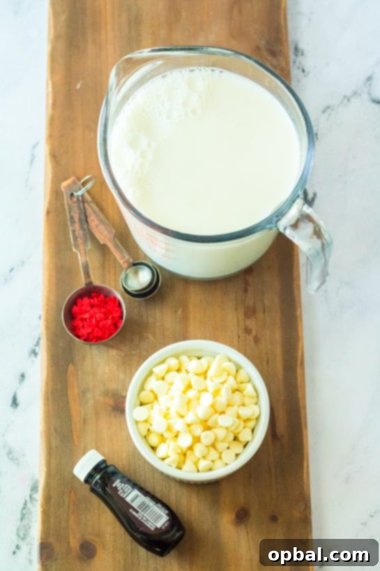 Grinchy Christmas Delight 5 Ingredients for Grinch Hot Chocolate recipe: milk, white chocolate chips, vanilla extract, peppermint extract, green food coloring, and red sprinkles.