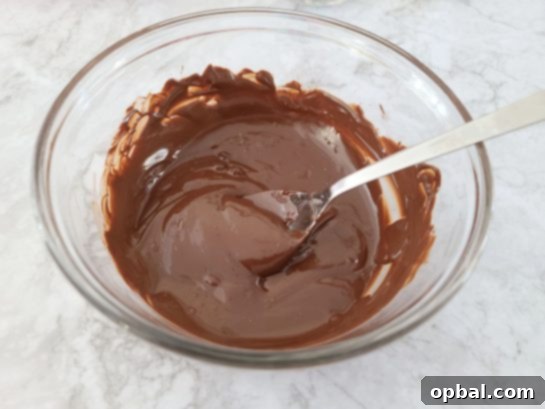 Melting chocolate in a bowl for the hot chocolate bomb shells.
