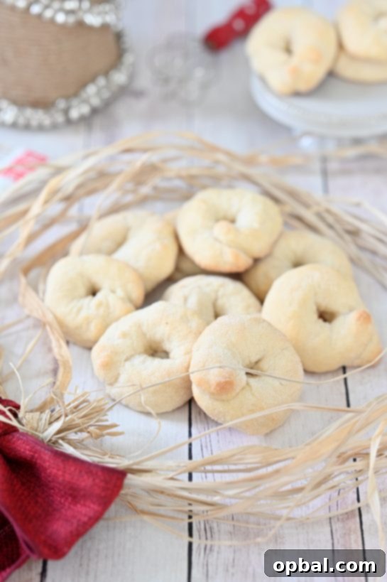 Rustic Italian Wine Biscuits 4 A stack of golden-brown Italian Wine Cookies (Ciambelle al Vino) on a white plate, invitingly presented for an afternoon snack with coffee.