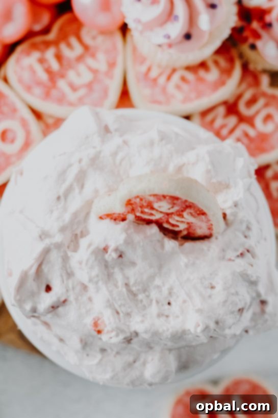 No Bake Strawberry Cake Batter Dip 6 Overhead shot of the creamy pink Strawberry Cake Mix Dip in a white bowl, ready to be served