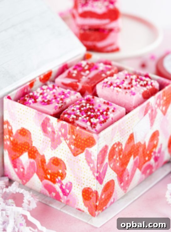 Sweetheart Swirl Strawberry Fudge 3 Easy Layered Valentine's Day Strawberry Fudge recipe uses just 4 easy ingredients and can be made in under 10 minutes! Pretty and cute gift for your favorite Valentine.