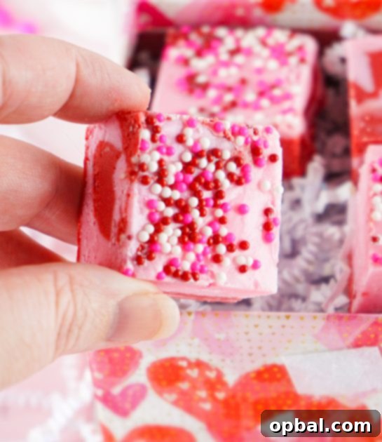 Sweetheart Swirl Strawberry Fudge 4 Beautiful Layered Valentine's Day Strawberry Fudge recipe requires just four simple ingredients and can be made in under 10 minutes! Pretty and cute gift for your Valentine.
