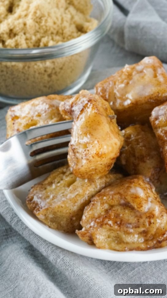 Crockpot Pull-Apart Perfection 2 Crock Pot Monkey Bread turns your classic monkey bread recipe into a delicious slow cooker creation. Full of delicious biscuits, coated in cinnamon and sugar, then drizzled with a rich icing. Perfect for breakfast or dessert.