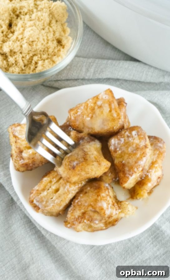 Crockpot Pull-Apart Perfection 11 Crock Pot Monkey Bread turns your classic monkey bread recipe into a delicious and rich creation. Full of delicious biscuits, coated in cinnamon and sugar, then drizzled with a rich icing. Perfect for brunch, breakfast or dessert.