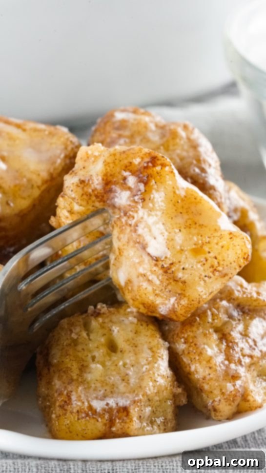 Crockpot Pull-Apart Perfection 12 Crock Pot Monkey Bread turns your classic monkey bread recipe into a delicious slow cooker creation. Full of delicious biscuits, coated in cinnamon and sugar, then drizzled with a rich icing. Perfect for brunch, breakfast or dessert.