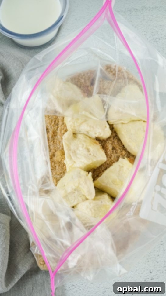 Crockpot Pull-Apart Perfection 6 Combining the sugar mixture with the biscuits needed to make the Crock Pot Monkey Bread