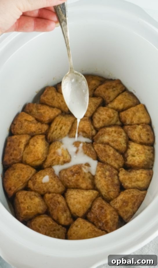 Crockpot Pull-Apart Perfection 7 Pouring in the glaze needed to make the Crock Pot Monkey Bread recipe