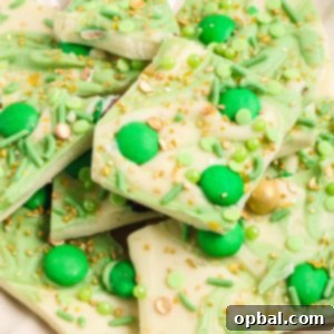 Leprechaun Bark candy recipe is loaded with colorful and green, festive toppings. It’s a different flavor and texture in every bite, tastes great, and is perfect for St. Patrick's Day!