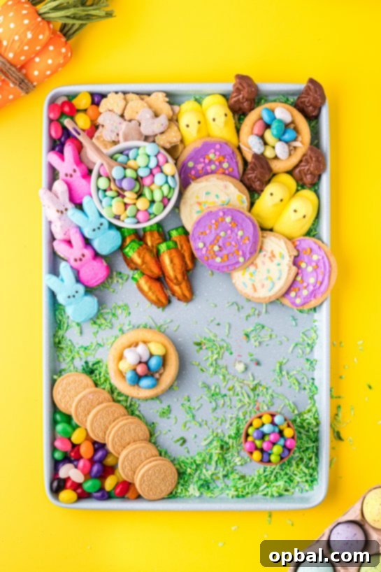 Easter Bloom Board 6 A vibrant selection of Easter candies and baked goods like frosted cookies and wafers, waiting to be arranged on a DIY charcuterie board.