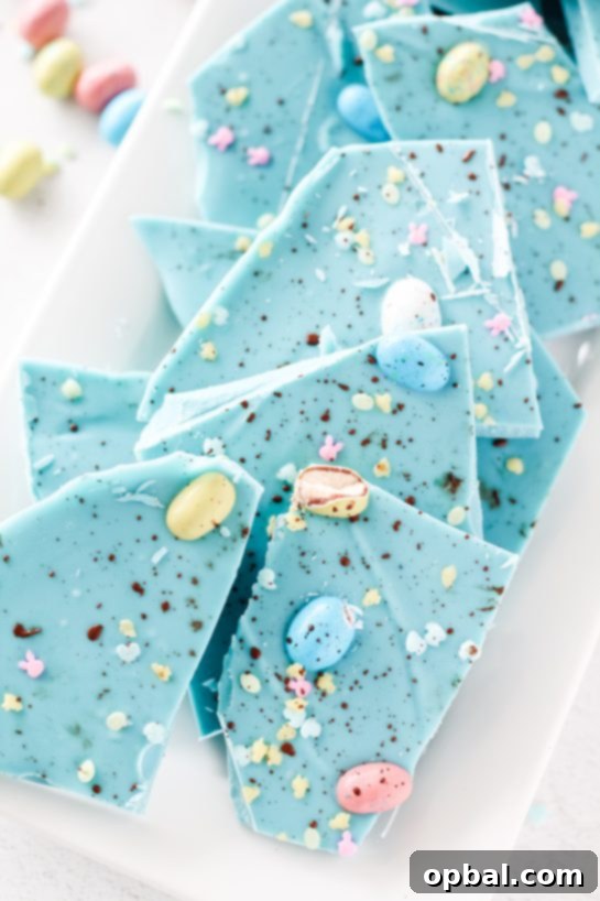 Speckled Robin's Egg Easter Bark 2 Stunning blue no-bake Robin Egg Easter bark with chocolate candy eggs for a festive Easter dessert.