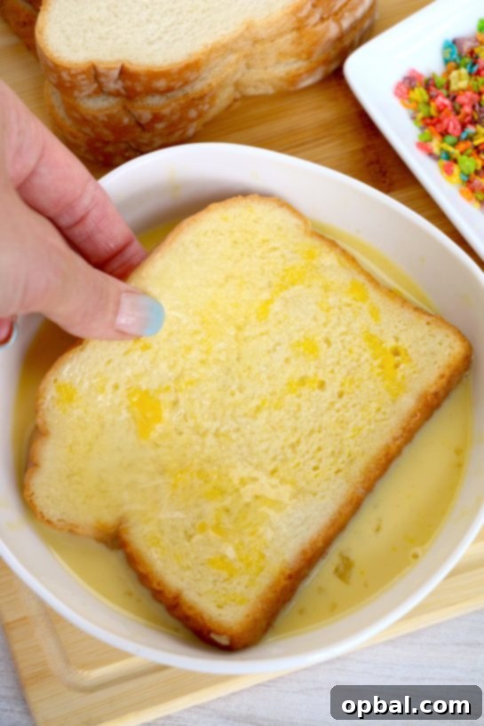 Crispy Air Fryer Fruity Pebble French Toast 5 Dipping the bread in the egg mixture for the Air Fryer Fruity Pebble French Toast recipe