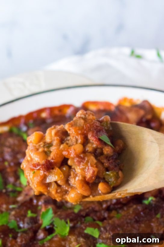 Hearty Beef & Bean Bake 3 Beefy Baked Beans are my favorite side dish recipe! Beans get mixed with ground beef, onion and bell pepper, brown sugar, ketchup, mustard and Worcestershire before getting topped with a peppered brown sugar bacon.