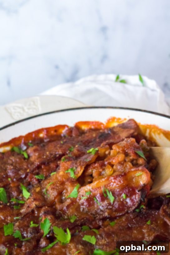 Hearty Beef & Bean Bake 8 Beefy Baked Beans are my favorite!! Beans get mixed with ground beef, onion and bell pepper, brown sugar, ketchup, mustard and Worcestershire before getting topped with a crispy, peppered brown sugar bacon.