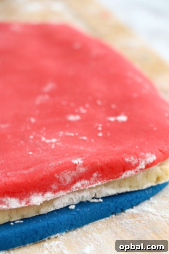 Patriotic Swirl Cookies 5 layering the colored dough to make the Patriotic Pinwheel Cookies recipe