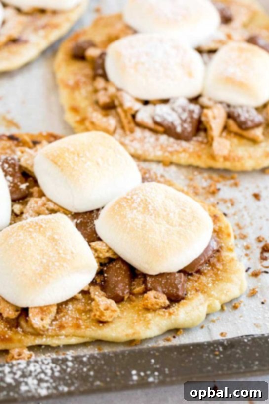 Ultimate S'mores Indulgences 9 S’mores Flatbread slathered with cinnamon-sugar flavored butter and topped with crumbled graham crackers, ooey gooey chocolate and marshmallows.