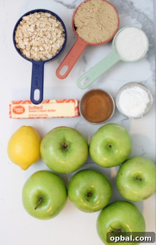 Fresh Granny Smith apples and ingredients laid out for Crock Pot Apple Crisp