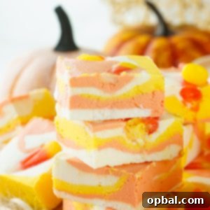 Tri-Color Candy Corn Fudge 11 No-Bake Candy Corn Fudge recipe is a delicious and easy Halloween treat for kids and adults. This creamy homemade fudge only needs 4 ingredients and 15 minutes to make!