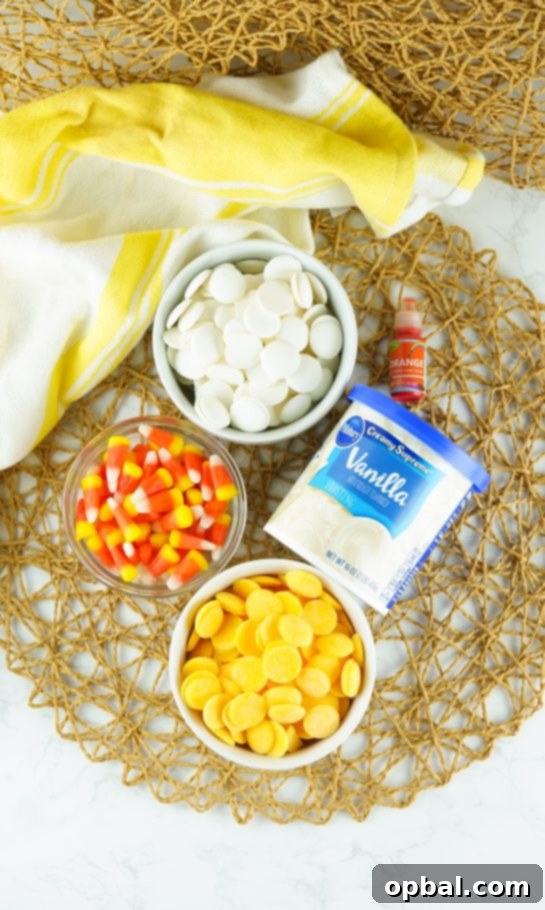 Tri-Color Candy Corn Fudge 3 Ingredients for making creamy No-Bake Candy Corn Fudge, including white and yellow candy melts, vanilla frosting, and candy corn.