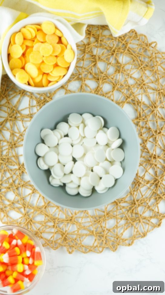 Tri-Color Candy Corn Fudge 4 Melting white chocolate in a bowl, a key step for making No-Bake Candy Corn Fudge.