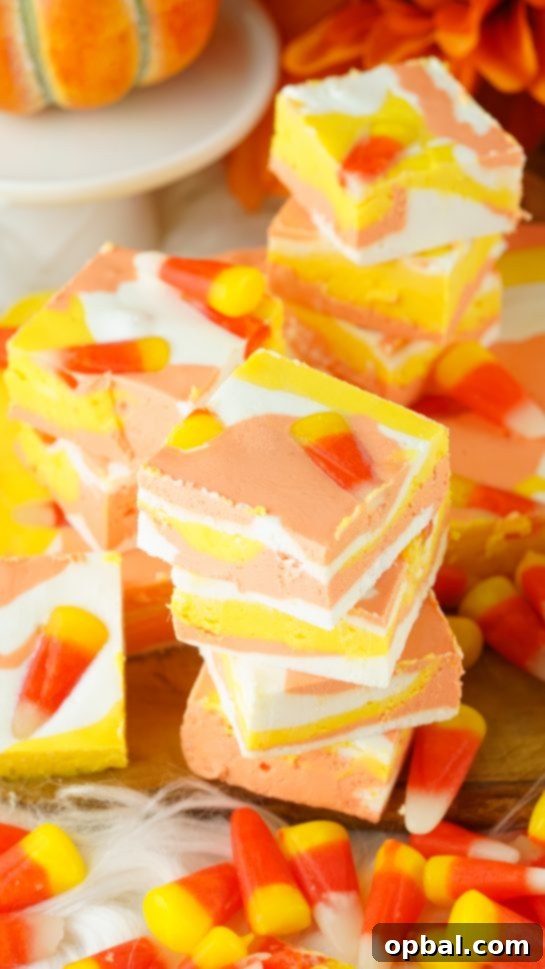 Tri-Color Candy Corn Fudge 7 Easy No-Bake Candy Corn Fudge recipe, a delicious and fun Halloween treat for kids and adults. Quick to make with just 4 ingredients in 15 minutes.