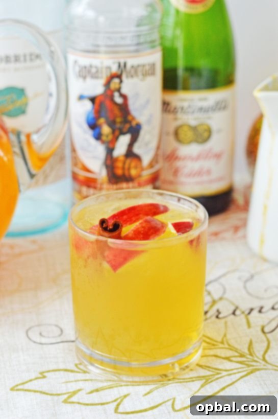 Pumpkin Patch Party Sangria 2 Pumpkin Sangria for a Crowd is a sweet, spiced, and full of fall flavors for the holiday season! This Pumpkin Sangria is perfect for autumn, Halloween pumpkin carving, Thanksgiving, or anytime!