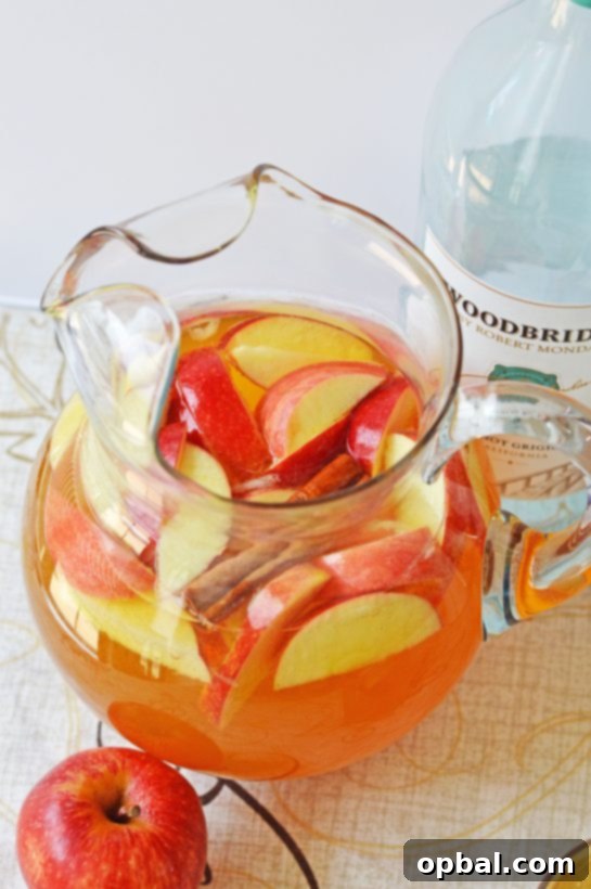 Pumpkin Patch Party Sangria 3 Pumpkin Sangria for a Crowd is a sweet, spiced, and full of fall flavors for the holiday season! This Pumpkin Sangria is perfect for autumn, Halloween pumpkin carving nights, Thanksgiving, or anytime!