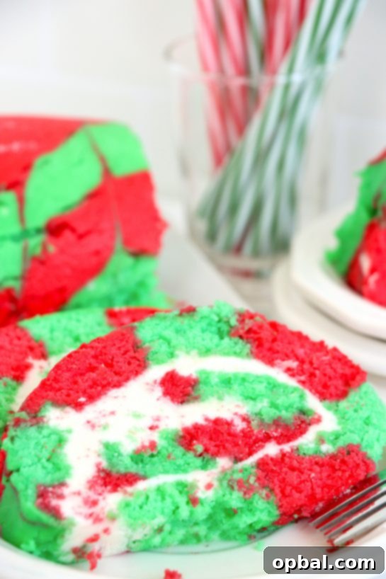Festive Yule Log Cake 8 A stunning Christmas Cake Roll, beautifully decorated and ready to be served, making it the ideal holiday dessert or festive treat.