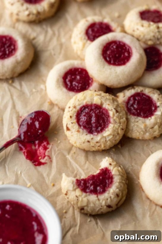 Signature Thumbprint Treats 16 Festive Cranberry Thumbprints, ideal for the holiday season and a beautiful addition to your Thanksgiving dessert table.
