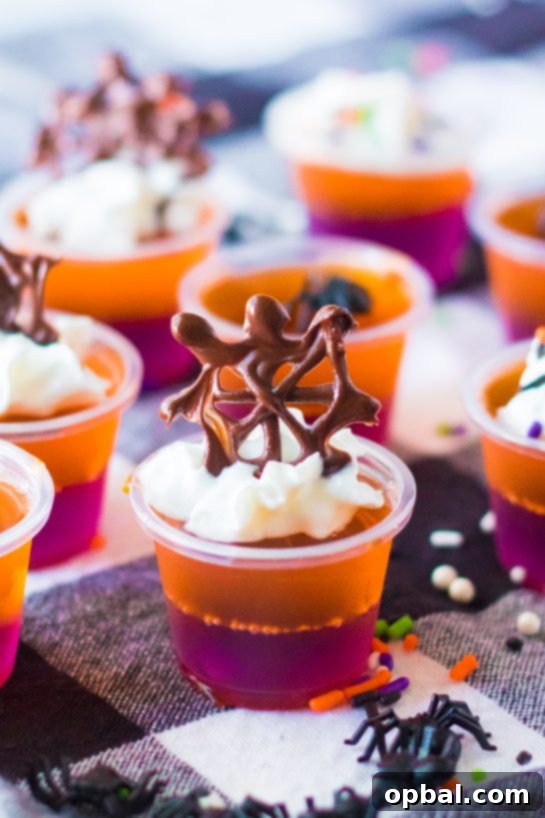 Elevate your Halloween party with these vibrant, boozy Halloween Jello Shots – a fun and flavorful cocktail favorite that's easy to make!