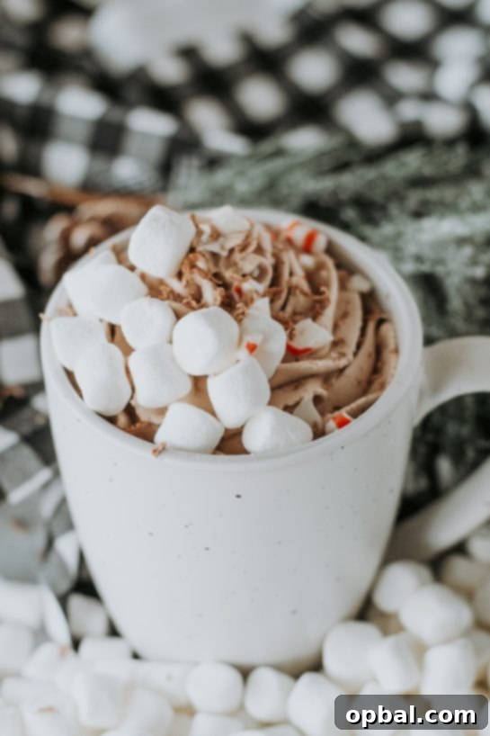 Pillowy Hot Chocolate 6 Artfully arranged mugs of whipped hot chocolate, perfect for holiday gatherings or a cozy treat during Christmas time.