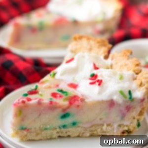 This Christmas Sugar Cream Pie recipe is my favorite for the holidays. This is a delicious creamy pie decorated with holiday sprinkles for a festive look. The filling is silky and rich - perfect for any occasion. The crust is a no-roll pie crust which makes it fabulous to throw together for the busy holiday season. 