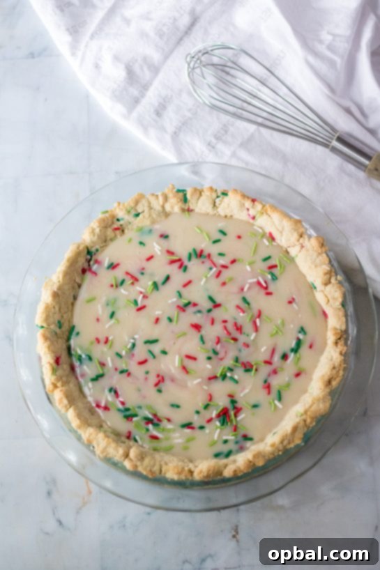 Velvet Sugar Pie 6 An overhead view of the assembled Christmas Sugar Cream Pie, beautifully sprinkled and ready for the oven.