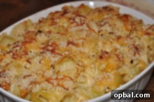 autumnchickenmacandcheese A creamy baked autumn mac and cheese dish featuring butternut squash, brussels sprouts, and tender chicken, perfect for a cozy fall meal.
