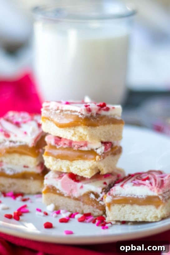 Sweet Valentine's Millionaire Bars 2 Exquisite Valentine's Day Millionaire Bars adorned with festive red and pink sprinkles, perfect for a romantic celebration.