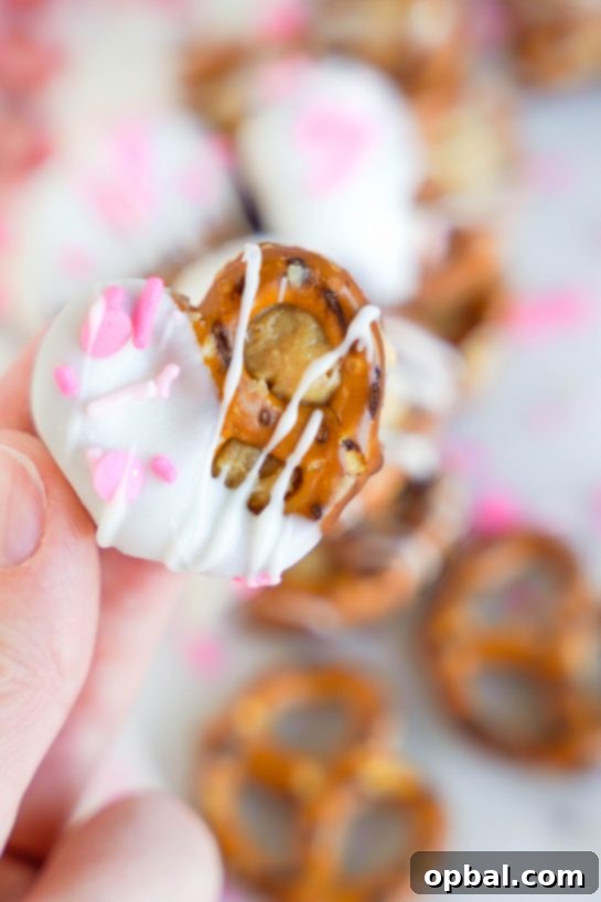 Sweetheart Pretzel Bites 13 Detailed close-up photo of a single Valentine's Day Pretzel Bite with peanut butter and sprinkles.