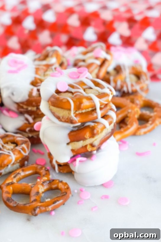 Sweetheart Pretzel Bites 9 Close-up of freshly made Valentine's Day Pretzel Bites, filled with peanut butter and dipped in white chocolate.