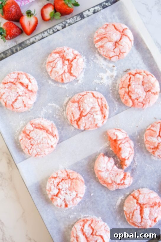Luscious Strawberry Crinkles 6 Freshly baked Strawberry Crinkle Cookies, still warm from the oven, ready to be enjoyed.
