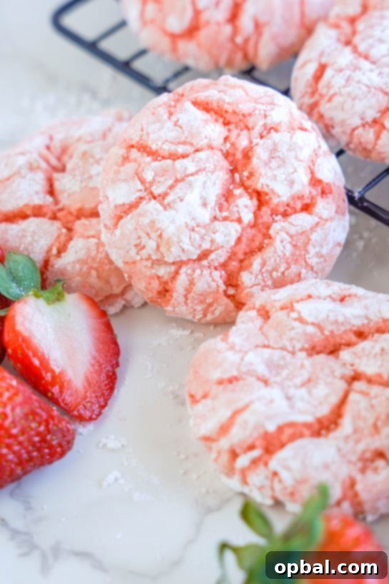 Luscious Strawberry Crinkles 8 Several freshly baked Strawberry Crinkle Cookies arranged, highlighting their ease of preparation and perfect results every time.