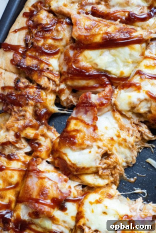 Sweet and savory Sheet Pan BBQ Chicken Pizza, perfect for holidays, parties, or weeknight dinners.