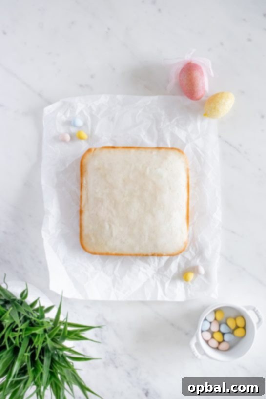 Robin's Egg Easter Cakelets 5 The golden-brown Easter Speckled Egg Snack Cake, perfectly baked in an 8x8 pan, cooling on a wire rack.