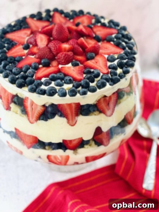 22 Firecracker Flavors for the Fourth 14 Summer Berry Trifle recipe loaded with red and blue berries, an amazing and easy-to-make crowd-pleasing dessert for the 4th of July.