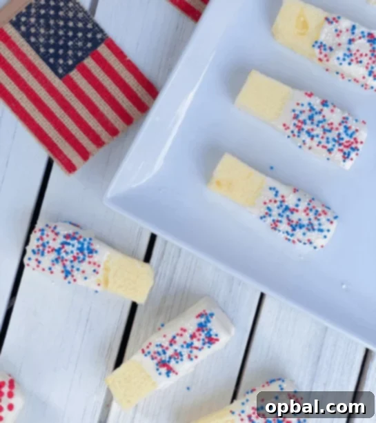 22 Firecracker Flavors for the Fourth 15 Tasty Pound Cake Sticks recipe, dipped in chocolate and sprinkled for the 4th of July, perfect for snacking during celebrations.