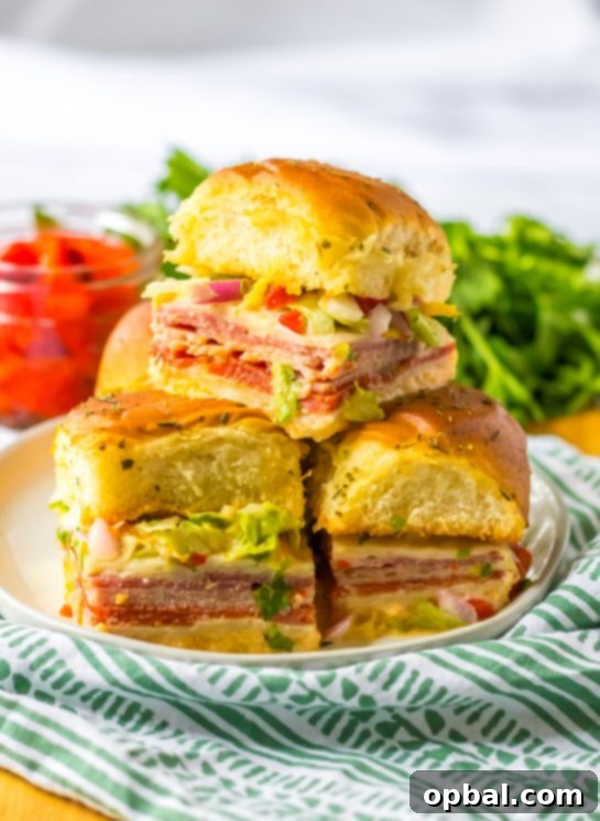 Zesty Italian Sliders 2 Italian Sub Sliders ready to be served on a platter, showcasing ham, salami, pepperoni, and provolone