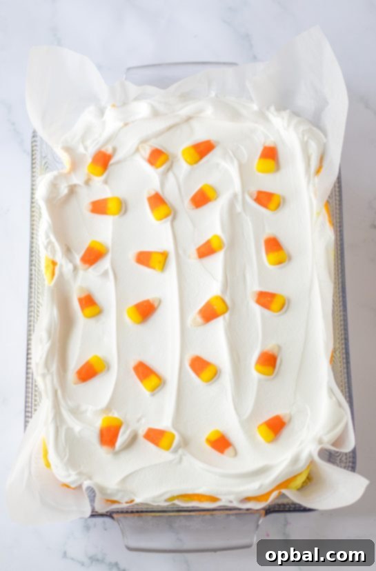 Decadent Candy Corn Delight 7 Adding on the candy corn garnish needed to make the candy corn lush for fall dessert recipe