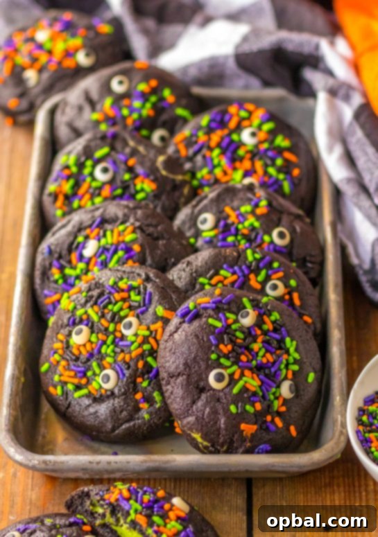 Midnight Velvet Stuffed Cookies 7 A beautifully arranged tray of Stuffed Black Velvet Cookies, ideal for a Halloween party dessert table.